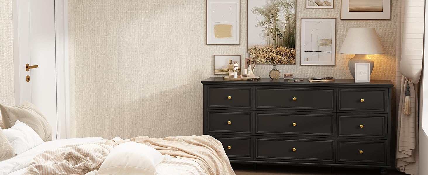black dresser with round knobs in a bedroom